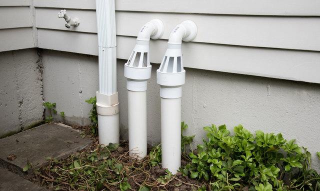 Sump pump discharge line routed to a safe outlet away from a Memphis foundation