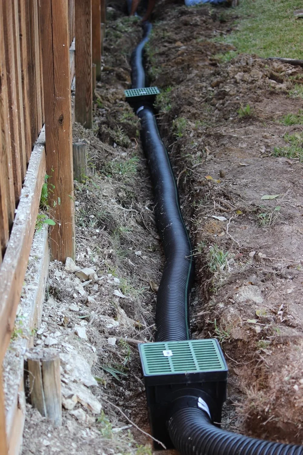 Professional drainage contractor installing French drain system in Memphis
